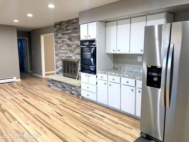 Building Photo - 3 br, 2.5 bath House - 5835 W. 10th Avenue
