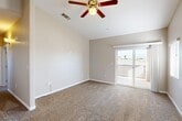 Located at 2600 Sablewood Dr in Bakersfield, CA, this single-story, 2-bedroom, 2-bathroom home offers a thoughtfully designed layout that maximizes comfort and functionality. The open-concept living and dining area features soaring vaulted ceilings, plush carpeting, and a ceiling fan, creating a bright and airy atmosphere. A sliding glass door leads to a private balcony with views of the surrounding neighborhood. The kitchen is well-equipped with rich, warm-toned cabinetry, granite countertops, tile flooring, and black appliances, including a refrigerator, range, and microwave. A pantry and separate dining area add to the kitchen's practicality. The spacious primary bedroom includes a walk-in closet with built-in shelving. Both bedrooms are carpeted and served by their respective bathrooms, which feature tile flooring and a shower/tub combination. Additional highlights include a dedicated laundry room, a hallway connecting the private areas of the home, and ample natural light throughout. The neutral color palette and clean finishes provide a versatile backdrop suitable for a variety of interior styles.