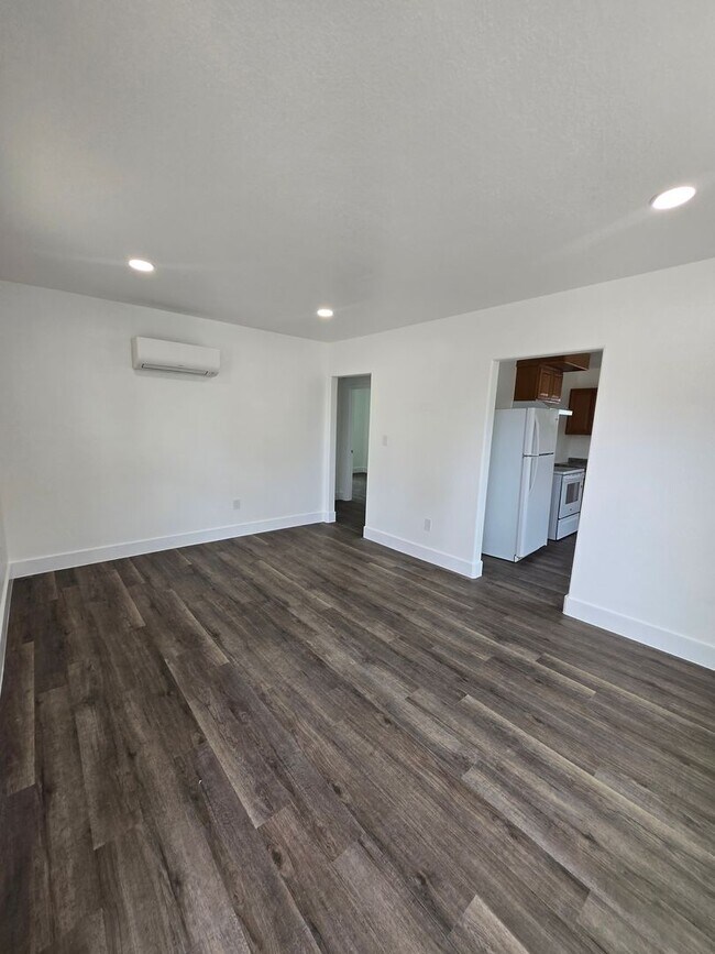 Building Photo - New paint and flooring throughout.
