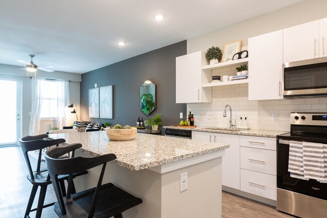 Gourmet kitchens include a Chef's island and pantry. - Windsor 335 Apartments