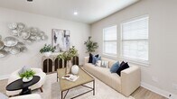 Located at 514 Deacon Drive W in College Station, TX, this thoughtfully designed two-story home offers 4 bedrooms and 4 bathrooms across two well-proportioned floors. The main floor provides generous living space, anchored by an open-concept living and dining area finished with light wood-style flooring, recessed lighting, and ceiling fans. The living room features large windows that invite natural light, creating a bright and welcoming atmosphere. The kitchen is a standout, boasting rich dark-stained cabinetry with black hardware, crisp white quartz countertops, a classic subway tile backsplash, stainless steel appliances, and a central island ideal for both meal prep and casual dining. The bathrooms are elegantly appointed with large-format marble-look tile surrounds and matte black fixtures throughout. Each of the four bedrooms is well-sized and comfortable, including a spacious primary suite with a dedicated en-suite bath and ample closet space. The upper floor offers additional private living quarters, connected by a staircase visible from the main living area. A dedicated laundry room adds everyday convenience. The home's neutral, modern palette and clean architectural lines create a cohesive, move-in-ready environment throughout.