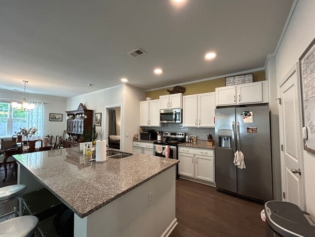 Building Photo - Charming home in Gated Community of Coffee...