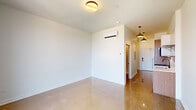 This single-floor unit showcases a cohesive modern design highlighted by polished concrete floors that run throughout the entire space, reflecting light and lending an airy, contemporary feel. The galley-style kitchen is thoughtfully outfitted with warm wood cabinetry paired with crisp white upper cabinets, a light quartz countertop, subway tile backsplash, stainless steel gas range, built-in microwave, refrigerator, and a single-basin sink with a matte black faucet. A large window at the end of the kitchen corridor allows natural light to filter in, offering views of the surrounding neighborhood. The open living area is bright and versatile, featuring clean white walls, a wall-mounted split AC unit, and pendant lighting that transitions seamlessly into the entry corridor. The front door is equipped with a modern keypad entry system. The bedroom is a quiet, minimalist space with white walls, polished concrete flooring, and a built-in closet rod. The bathroom continues the unit's clean aesthetic with a floating vanity, mirrored medicine cabinet, globe pendant light, tiled shower surround, and matching polished concrete floors, creating a unified and refined finish across the entire unit.