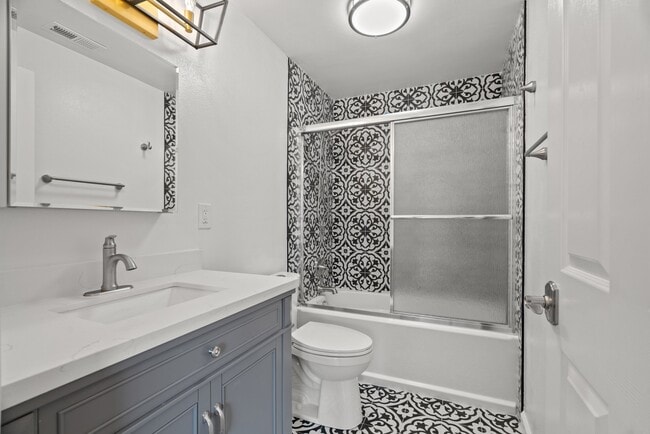 Modern renovated full bathroom with a tub - 411 124th St S