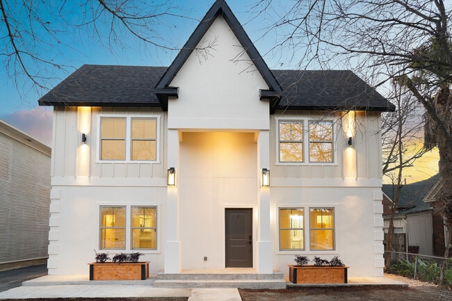 Renovated historic fourplex with architectural exterior lighting and private entry - Mistletoe Manor