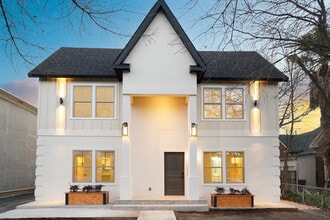 Renovated historic fourplex with architectural exterior lighting and private entry - Mistletoe Manor