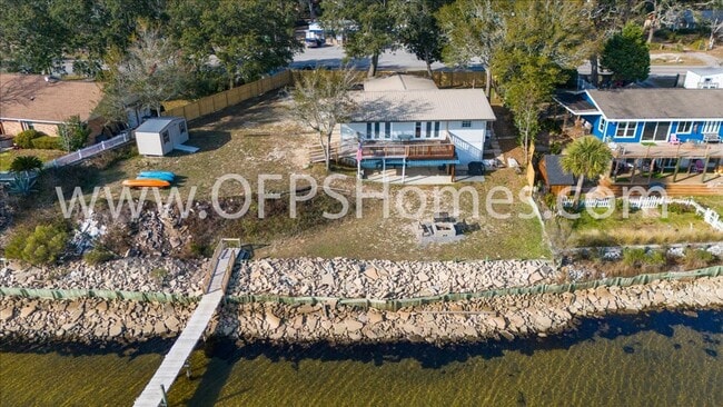 Building Photo - Stunning 4-Bedroom, 3-Bath Waterfront Home in Choctaw Beach – 140ft of Bayfront Bliss!