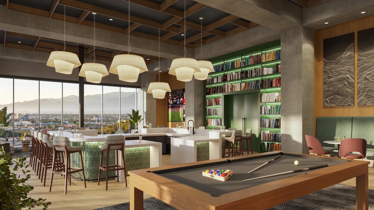 Take part in friendly competition in the clubroom with billiards. - Modera Scottsdale