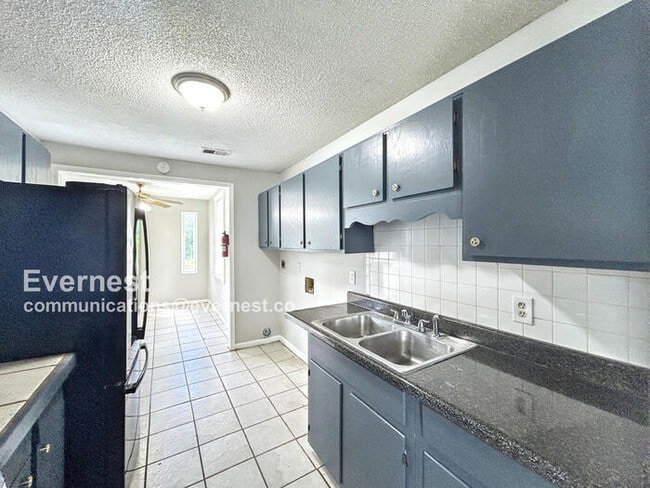 Photo - Spacious 3 Bed, 1 Bath Home with Fenced Yard and Off-Street Parking