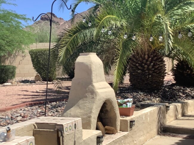 Outdoor fireplace in backyard with Mountain View’s - 1502 E Estrid Ave