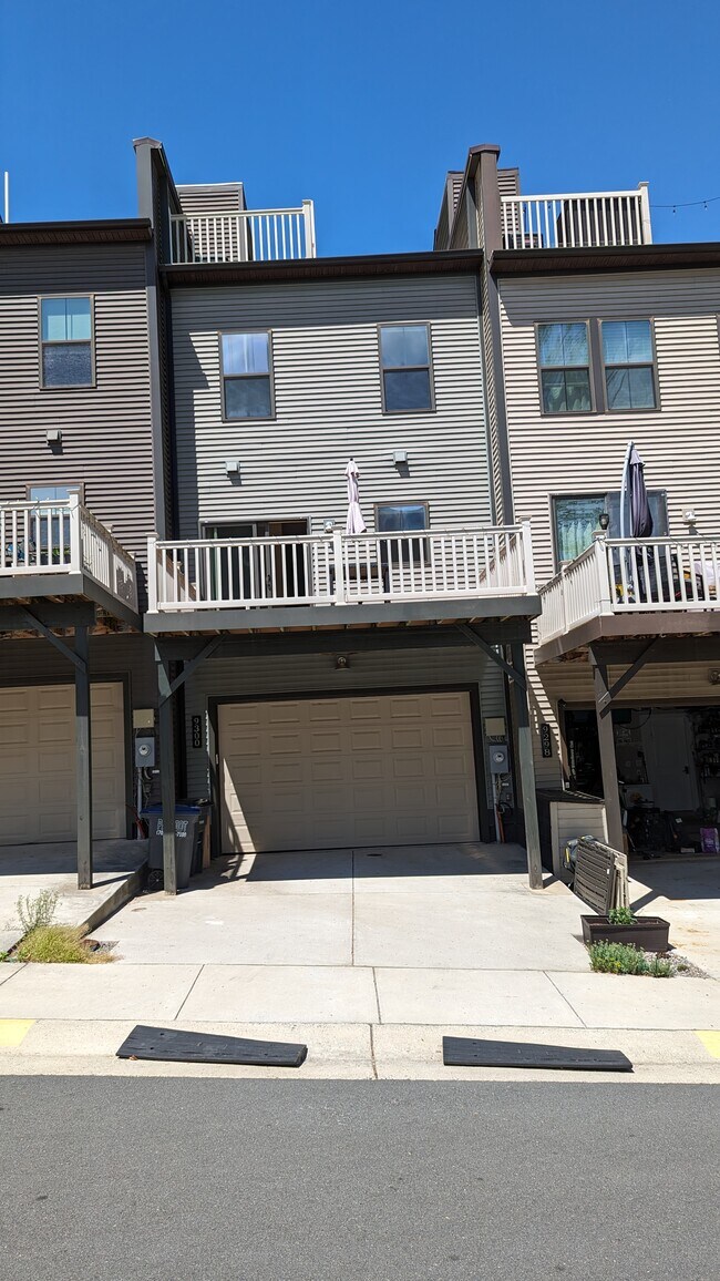 Back view and 2-car garage - 9300 Wild Black Cherry Ct