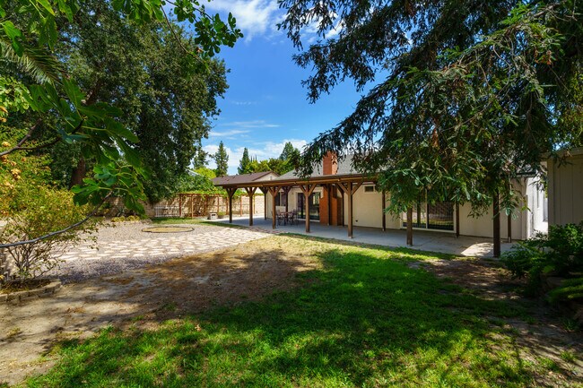 Spacious, shaded backyard. - 7701 Maestro Ave