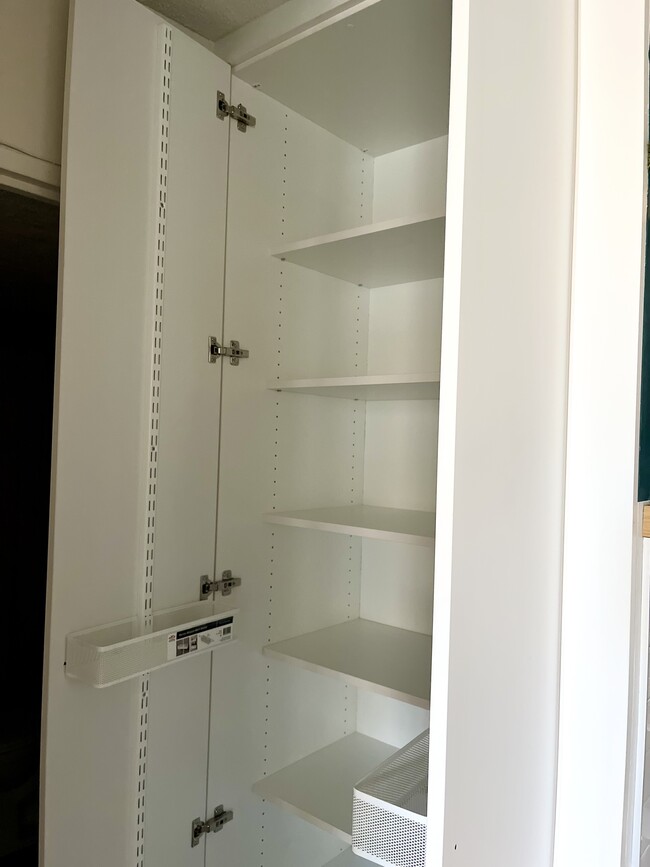 Linen closet with tons of storage and movable baskets - 300 M St SW