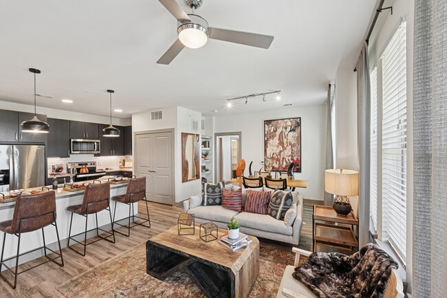 Kitchen, living, and dining area with hard surface flooring - Avalon Benbrook