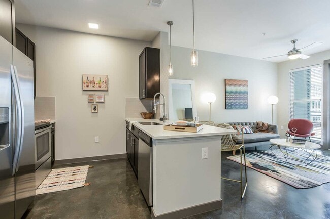 Building Photo - Your Downtown Lifestyle Begins Now