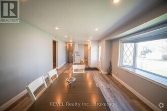 Building Photo - 8685 Roosevelt Ave
