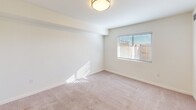 Located at 601 Orange Ave NE in Roanoke, Virginia, this two-bedroom, two-bathroom residence offers a practical and well-organized single-floor layout. The kitchen is a standout feature, equipped with stainless steel appliances including a refrigerator and dishwasher, white shaker-style cabinetry, light granite-look countertops, and wood-look flooring that adds warmth to the space. A hallway connects the main living areas to the two bedrooms and bathrooms, providing a logical and functional flow throughout. Both bedrooms are finished with soft neutral carpet, crisp white walls, and windows fitted with blinds that allow natural light to filter in. The primary bedroom offers a comfortable footprint with its own dedicated closet. Each of the two full bathrooms features a tub and shower combination with a curtain rod, a toilet, and durable wood-look flooring, presenting a clean and consistent aesthetic. Two closets provide ample storage throughout the residence. The overall design is clean, neutral, and move-in ready, with a consistent color palette of whites and warm neutrals that creates a bright and welcoming atmosphere throughout.