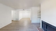 Located at 1000 Windsor Shores Dr in Columbia, SC, this well-appointed one-bedroom, one-bathroom unit offers a comfortable and efficient layout across a single floor. The open living room is a standout feature, showcasing smooth hardwood-style flooring, a classic brick fireplace, and built-in shelving that adds both character and functionality. A sliding glass door leads to a private balcony, filling the space with natural light and offering pleasant outdoor views of the surrounding greenery. The kitchen is thoughtfully designed with rich dark wood cabinetry, granite countertops, a double stainless steel sink, and light wood-style flooring, creating a clean and modern aesthetic. The bedroom is carpeted for comfort, featuring a ceiling fan with integrated lighting and a window that frames a lush, tree-lined view. Two closets provide ample storage throughout the unit. The bathroom continues the cohesive design with matching dark wood cabinetry, granite countertops, a large mirror, and a full tub-shower combination. A hallway connects the rooms efficiently, completing this tidy and inviting floor plan well-suited for comfortable everyday living.