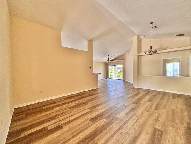Building Photo - Large 4/2 with new floors in gated community!