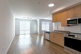 Located at 481 S Mathilda Ave in Sunnyvale, California, this 1-bedroom, 1-bathroom unit offers a clean, modern design with a thoughtful layout across a single floor. Light wood-tone flooring runs throughout, creating a warm, cohesive aesthetic that connects each space seamlessly.

The open-concept kitchen and living area forms the heart of the unit. The kitchen is outfitted with light wood cabinetry, a white subway tile backsplash, stainless steel appliances including a refrigerator, electric range, built-in microwave, and dishwasher, along with a double-basin sink with a modern faucet. The living area adjacent to the kitchen benefits from natural light streaming through large windows dressed with horizontal blinds, and features track lighting overhead.

The bedroom is a well-proportioned retreat with clean white walls, light wood flooring, and ample room for furnishings. A dedicated walk-in closet equipped with adjustable wire shelving and hanging rods provides generous storage capacity.

The bathroom continues the unit's consistent design language, featuring a wood-toned vanity with drawers and cabinets, a large mirror with overhead lighting, and wood-look flooring. In-unit laundry is conveniently accessible from the bathroom area. A hallway connects the rooms efficiently, completing this well-designed, functional living space.