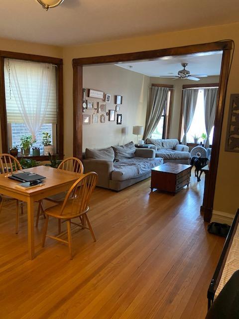 Living and dining room with TONS of natural light. - 2848 W Diversey Ave