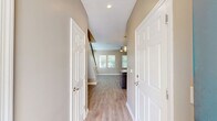 Located at 3050 Old River Road in Jacksonville, FL, this two-story home offers 2 bedrooms and 3 bathrooms thoughtfully distributed across two floors. The entry level welcomes you through a hallway with light wood-look flooring that flows into an open living area filled with natural light from multiple windows fitted with blinds. A ceiling fan keeps the space comfortable throughout. The kitchen is a standout feature, showcasing rich dark cabinetry, granite countertops, stainless steel appliances including a dishwasher and range, and ample storage. A convenient dedicated laundry room with full-size washer and dryer is also located on this floor, alongside an attached single-car garage with automatic opener. Upstairs, the two bedrooms are carpeted for comfort, each offering ceiling fans and natural light. The spacious primary bedroom features two windows and generous closet space, while the secondary bedroom provides a cozy retreat. Four closets throughout the home, including walk-in options with wire shelving, offer excellent storage. The three bathrooms are well-appointed with dark vanity cabinetry, granite countertops, light wood-look tile flooring, and tiled showers, maintaining a cohesive and modern aesthetic throughout the home.