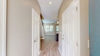 Located at 3050 Old River Road in Jacksonville, FL, this two-story home offers 2 bedrooms and 3 bathrooms thoughtfully distributed across two floors. The entry level welcomes you through a hallway with light wood-look flooring that flows into an open living area filled with natural light from multiple windows fitted with blinds. A ceiling fan keeps the space comfortable throughout. The kitchen is a standout feature, showcasing rich dark cabinetry, granite countertops, stainless steel appliances including a dishwasher and range, and ample storage. A convenient dedicated laundry room with full-size washer and dryer is also located on this floor, alongside an attached single-car garage with automatic opener. Upstairs, the two bedrooms are carpeted for comfort, each offering ceiling fans and natural light. The spacious primary bedroom features two windows and generous closet space, while the secondary bedroom provides a cozy retreat. Four closets throughout the home, including walk-in options with wire shelving, offer excellent storage. The three bathrooms are well-appointed with dark vanity cabinetry, granite countertops, light wood-look tile flooring, and tiled showers, maintaining a cohesive and modern aesthetic throughout the home.