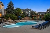 Located at 12255 Claude Ct in Northglenn, CO, this well-appointed 2-bedroom, 2-bathroom single-floor unit spans 950 square feet with a thoughtful layout connecting all key living spaces. The living room is a standout, featuring a white-surround fireplace, crown molding, and a sliding glass door that opens to a private balcony with outdoor views, complemented by large windows that bring in abundant natural light. Warm hardwood-style flooring flows consistently throughout the entire unit. The kitchen follows a galley design with white cabinetry, granite-style countertops, a stainless steel refrigerator, range, dishwasher, and microwave. A pass-through counter connects the kitchen to the living area, creating an open feel. The primary bedroom measures 170 square feet and includes a ceiling fan and closet access. The second bedroom also features a ceiling fan and a bright window with outdoor views. Both bedrooms have access to their respective bathrooms: the primary bath includes a walk-in shower with glass enclosure and white vanity, while the second bath features a full tub-shower combo. A dedicated in-unit laundry area and three closets provide ample storage throughout this move-in-ready home.