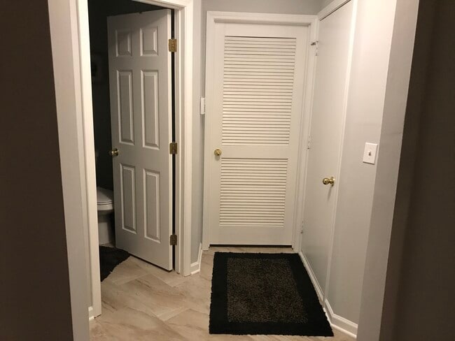 Laundry room, large coat closet and powder room off the garage on the first level - 49730 Plymouth Way