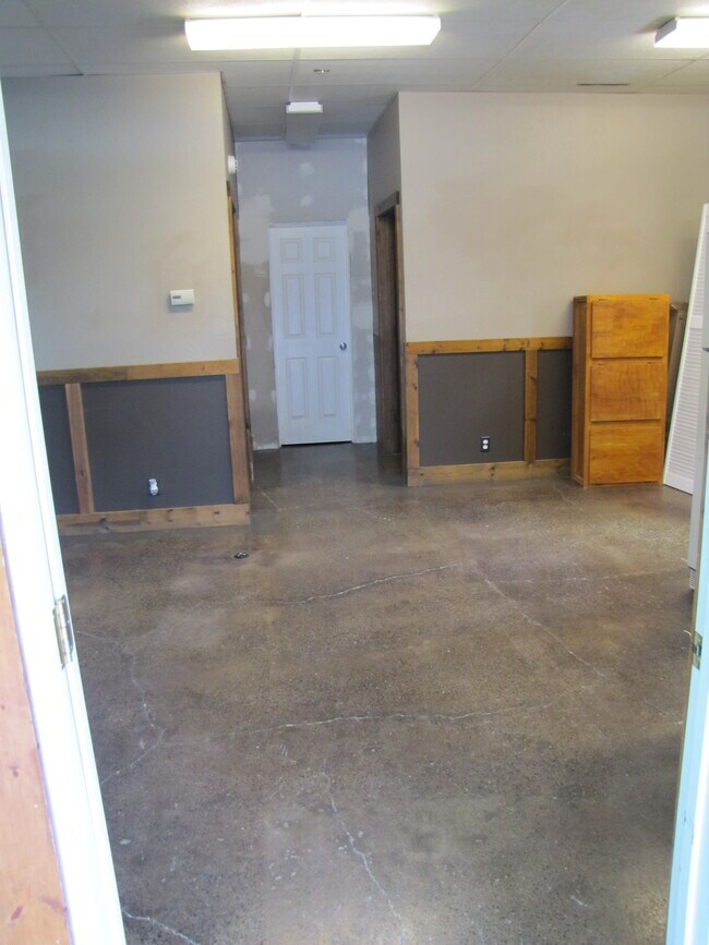 Looking toward restroom and storage across the second and main space. - 712 Bridge St