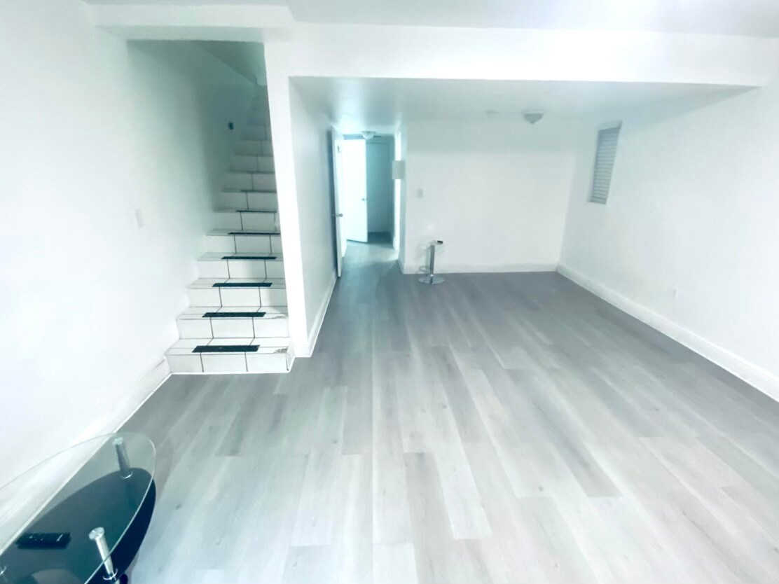 Spacious living room area with lvt flooring - 10901 N Kendall Dr