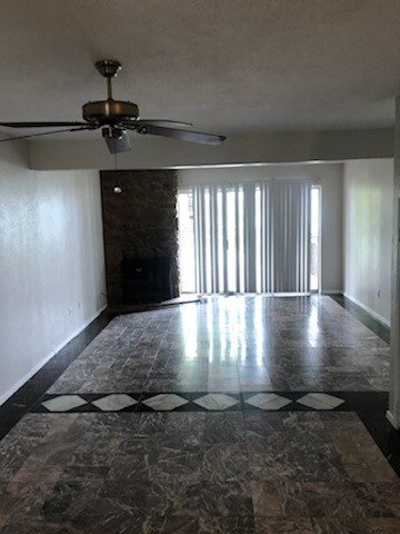 living room off kitchen with patio attached looking out on lake - 3824 Mediterranean St