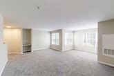This well-laid-out 3-bedroom, 2-bathroom unit at 3119 75th Ave in Hyattsville, MD offers a comfortable and functional single-floor living experience. The open living and dining area is generously sized, featuring neutral-toned carpet, built-in shelving, and multiple windows that fill the space with natural light and offer pleasant outdoor views of surrounding greenery.

The kitchen is efficiently designed in a U-shaped layout, outfitted with warm oak cabinetry, light granite-style countertops, white appliances including a range, dishwasher, and refrigerator, and wood-look vinyl flooring that extends throughout the wet areas of the home.

All three bedrooms are carpeted and finished with neutral walls, providing a calm and versatile backdrop. Each room benefits from window access, with the bedrooms offering views of the tree-lined surroundings. The primary bedroom is a comfortable retreat with dedicated closet access.

Both bathrooms mirror each other in style, featuring oak vanities with granite-style countertops, wood-look flooring, and clean white fixtures. One bathroom includes a walk-in shower with tile surround, while the other is similarly appointed. The overall aesthetic throughout the unit is clean, neutral, and move-in ready.