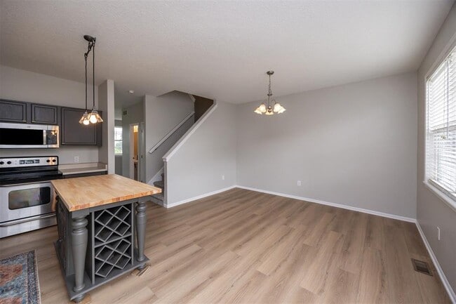 Kitchen: Countertops are now hard stone and faucet is matte black - 928 NE Kamies Ln