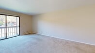 Located at 11614 Old Ballas Rd in Creve Coeur, Missouri, this two-bedroom, one-bathroom unit offers a practical and functional single-floor layout. The primary bedroom is notably generous in size, featuring wall-to-wall carpet, neutral-toned walls, a ceiling fan with light fixture, and a built-in closet with bifold doors. A second set of doors flanks one wall, providing additional access and storage flexibility. The second bedroom is carpeted as well and benefits from a window that allows natural light and views of surrounding greenery.

The kitchen is equipped with white cabinetry, a dishwasher, a refrigerator, and a stainless steel sink, all set atop tile flooring that extends into the bathroom. The bathroom includes a vanity with under-sink cabinet storage, a combined tub and shower with tiled surround, and a toilet, offering a clean and efficient layout. Throughout the unit, a neutral color palette of whites and beiges creates a cohesive, understated ambiance. Two closets provide organized storage. The overall floor plan, as seen in the dollhouse view, presents a compact yet well-organized arrangement suited for comfortable everyday living.