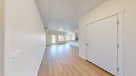 Located at 10602 Burns Rd in Pasco, WA, this well-appointed one-bedroom, one-bathroom unit offers a clean, modern design across a single floor. The open-concept living and kitchen area is bright and airy, featuring light wood-style flooring, white walls, and large windows that invite natural light and provide views of the surrounding neighborhood. A private entry door adds convenience and a sense of independence.

The kitchen is thoughtfully designed with light wood cabinetry, a sleek quartz-style countertop island with a double sink, and a full suite of stainless steel appliances including a refrigerator, electric range, microwave, and dishwasher. Track lighting overhead highlights the functional and stylish workspace.

The spacious bedroom is carpeted for comfort, includes a wall-mounted mini-split heating and cooling unit for year-round climate control, and features a window with outdoor views. The bathroom offers a full tub-shower combination with clean white surrounds. A dedicated laundry room houses a full-size Whirlpool washer and dryer with overhead wire shelving for added storage. A closet provides additional organization space, completing this efficient and modern single-level layout.