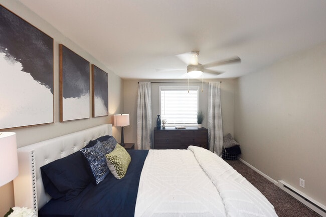 Experience serene comfort in this beautifully designed bedroom oasis. - Oaks at Old Hickory