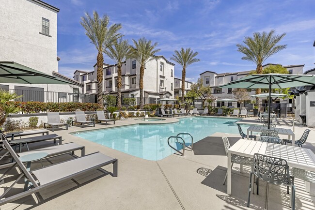 Dive into luxury living at Michael B Apartments, where every day feels like a vacation with our resort-style pool and inviting lounge area. - The Michael B Townhomes and Flats