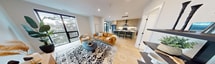 This contemporary 930 sq ft apartment in London, Ontario, offers a harmonious blend of style and functionality. The open-concept layout seamlessly integrates the kitchen, dining, and living areas, creating a spacious feel. The kitchen is a standout feature, boasting light wood cabinetry, stainless steel appliances, and a striking island with seating for three. 

Both bedrooms are generously sized, with the primary bedroom measuring 150 sq ft. Large windows in the bedrooms and living areas flood the space with natural light and offer picturesque views. The bathrooms feature modern fixtures, including a glass-enclosed shower with terrazzo-style tiling.

Throughout the apartment, you'll find high-end finishes and thoughtful design elements. Hardwood floors, recessed lighting, and stylish light fixtures add to the overall ambiance. The living room is anchored by a comfortable leather sofa and accented with a unique oval mirror and lush plants, creating a welcoming atmosphere.

Storage is ample, with two closets complementing the bedroom spaces. The apartment's neutral color palette is enlivened by carefully chosen artwork and decorative elements, striking a perfect balance between sophistication and comfort in this urban dwelling.
