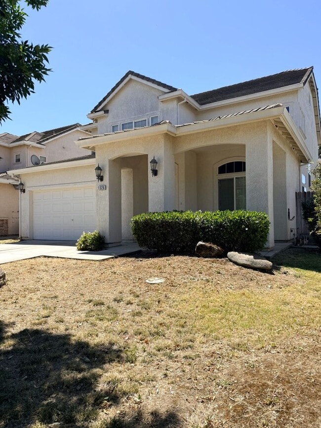 Building Photo - A must see 4/3 with a bedroom downstairs for convenience.