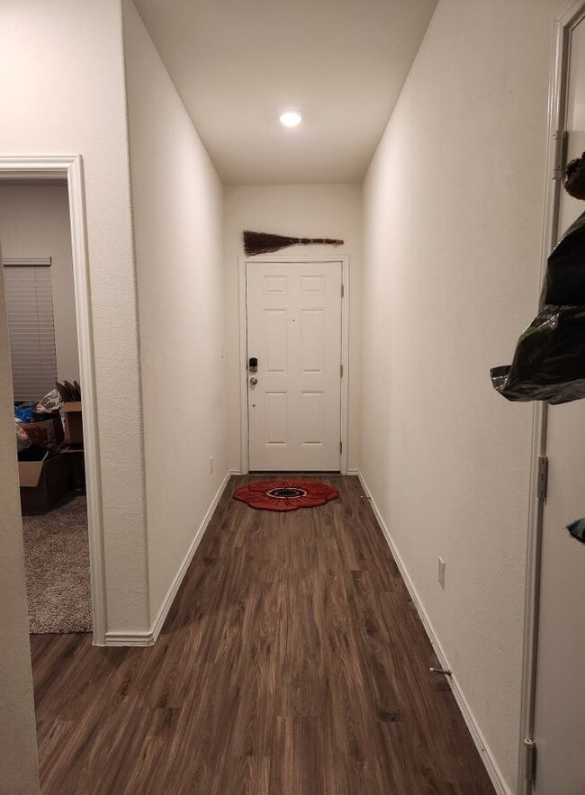 Entry hallway with garage door to the right. - 13306 Mussel Run