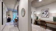 Located at 315 First Ave NE in Minneapolis, this one-bedroom, one-bathroom unit offers a thoughtfully designed urban living experience with distinctive industrial-modern character. Exposed concrete ceilings and light wood-style flooring run throughout, lending the space a loft-inspired aesthetic that feels both contemporary and grounded.

The open-concept living, dining, and kitchen area serves as the heart of the unit. The kitchen features dark cabinetry, stainless steel appliances, and an island with bar seating, flowing seamlessly into the living and dining areas. Large windows invite abundant natural light and urban views, enhancing the sense of openness.

A versatile den provides dedicated space ideal for a home office, complete with its own area for a desk and shelving. The primary bedroom is well-proportioned, with a floor-to-ceiling window overlooking the surrounding cityscape and exposed ductwork that reinforces the industrial aesthetic. Two closets offer generous storage throughout the unit.

The bathroom includes a full soaking tub and shower combination with clean gray tile surround and light wood-look tile flooring. Additional conveniences include an in-unit laundry area and a private balcony, perfect for enjoying outdoor views. This unit delivers a refined yet functional urban living experience in the heart of Minneapolis.