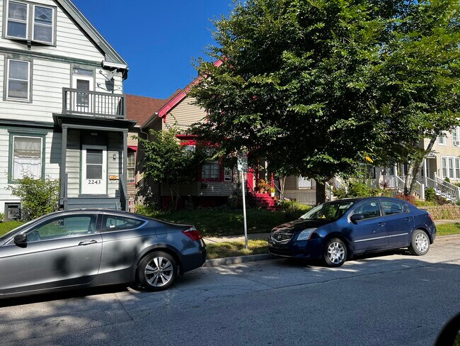 Lower unit of house with red trim. Located on quiet well maintained block. - 2247 North Summit Avenue