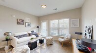 Located at 1905 Stelzer Rd in Columbus, Ohio, this one-bedroom, one-bathroom residence offers a thoughtfully designed single-floor layout with modern finishes and a clean, contemporary aesthetic throughout. The open-concept kitchen and living area serves as the heart of the home, where wood-style flooring, gray flat-front cabinetry, granite countertops, a peninsula with pendant lighting, and a full suite of stainless steel appliances create a functional and stylish cooking space. The living room flows naturally from the kitchen, featuring plush carpet, neutral warm-toned walls, and large windows with horizontal blinds that invite generous natural light. A private exterior door adds convenient access directly from the living area. The bedroom is a comfortable retreat with soft carpeting, two large windows overlooking the outdoors, and direct sightlines to the kitchen, reinforcing the open feel of the floor plan. The bathroom is finished with a granite-topped gray vanity, a framed mirror, and wood-style flooring, maintaining design consistency with the rest of the home. Three closets, including a spacious walk-in fitted with wire shelving, provide ample storage. Additional utility and laundry rooms round out the practical amenities of this well-appointed residence.