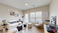 Located at 1905 Stelzer Rd in Columbus, Ohio, this one-bedroom, one-bathroom residence offers a thoughtfully designed single-floor layout with modern finishes and a clean, contemporary aesthetic throughout. The open-concept kitchen and living area serves as the heart of the home, where wood-style flooring, gray flat-front cabinetry, granite countertops, a peninsula with pendant lighting, and a full suite of stainless steel appliances create a functional and stylish cooking space. The living room flows naturally from the kitchen, featuring plush carpet, neutral warm-toned walls, and large windows with horizontal blinds that invite generous natural light. A private exterior door adds convenient access directly from the living area. The bedroom is a comfortable retreat with soft carpeting, two large windows overlooking the outdoors, and direct sightlines to the kitchen, reinforcing the open feel of the floor plan. The bathroom is finished with a granite-topped gray vanity, a framed mirror, and wood-style flooring, maintaining design consistency with the rest of the home. Three closets, including a spacious walk-in fitted with wire shelving, provide ample storage. Additional utility and laundry rooms round out the practical amenities of this well-appointed residence.
