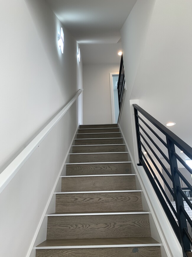 Stairway from living room up to third level - 612 NW 85th St