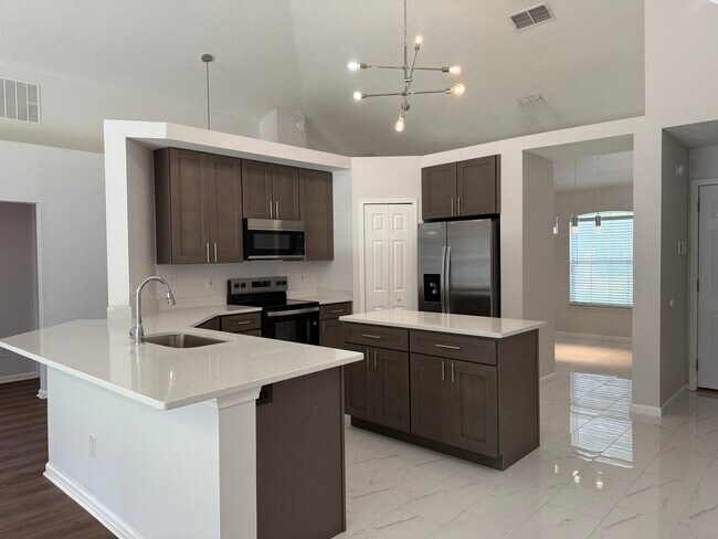 Foto del edificio - 5458 Hidden Gardens Dr