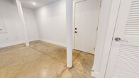 This 620 square foot, one-bedroom apartment in Columbia, SC, offers a modern living experience with a thoughtful design. The space is characterized by its polished concrete floors, which extend throughout the unit, creating a contemporary industrial aesthetic. The open-concept layout maximizes the use of space, with the living area seamlessly flowing into the kitchen.

The kitchen is a standout feature, boasting dark wood cabinetry that contrasts beautifully with stainless steel appliances. Granite countertops add a touch of luxury, while a subway tile backsplash completes the modern look. The kitchen is fully equipped with a refrigerator, stove, dishwasher, and built-in microwave.

The bathroom is sleek and functional, featuring a combined tub and shower with a curved shower rod, and a single vanity with ample storage. Large format tiles on the floor complement the overall design.

The bedroom, measuring 120 square feet, provides a cozy retreat. The apartment also includes the convenience of in-unit laundry, with a stacked washer and dryer. Throughout the space, recessed lighting illuminates the rooms, while a window allows natural light to filter in.

Storage solutions are integrated into the design, with a closet in the main living area and additional storage in the bedroom. The apartment's efficient layout and modern amenities make it an ideal choice for urban living in Columbia.