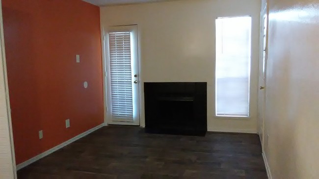 living area with fireplace - Chapel Oaks Apartments