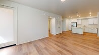 Located at 3644 Harrison St in Riverside, CA, this single-floor, 3-bedroom, 2-bathroom unit offers a clean, modern design with a bright and neutral color palette throughout. Light wood-style flooring flows seamlessly across every room, creating a cohesive and airy feel.

The open-concept living area connects directly to a well-appointed kitchen, which features white shaker cabinetry with brushed nickel hardware, light quartz countertops, a center island, recessed lighting, and a full suite of stainless steel appliances including a refrigerator with ice maker, range, microwave, and dishwasher.

The three bedrooms are comfortably sized, with the primary bedroom offering its own dedicated space and closet access. The secondary bedrooms receive generous natural light through sizable windows fitted with blinds, with outdoor views of the surrounding neighborhood. Two hallways and two closets provide practical storage and circulation throughout the unit.

Both bathrooms are finished in a clean, contemporary style with white surrounds, soaking tub-shower combinations, light countertops, and white cabinetry. One bathroom includes built-in open shelving for added storage convenience. The overall ambiance of the unit is bright, functional, and move-in ready.